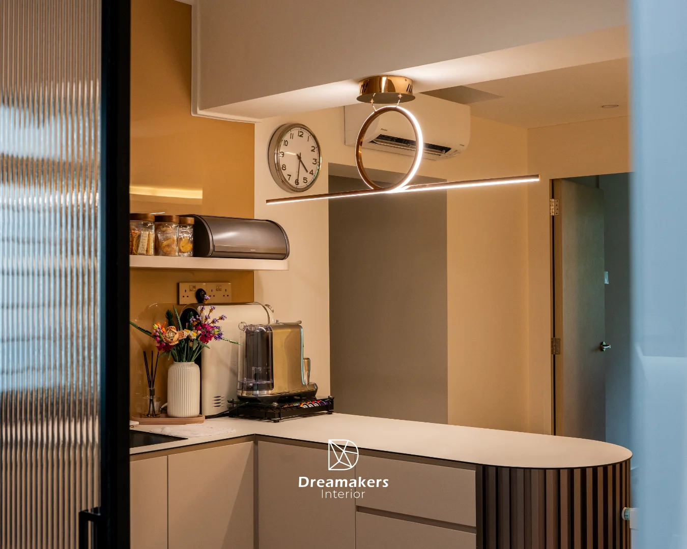 Curved coffee bar counter against caramel walls with rose-gold pendant, Sengkang 5-room resale kitchen