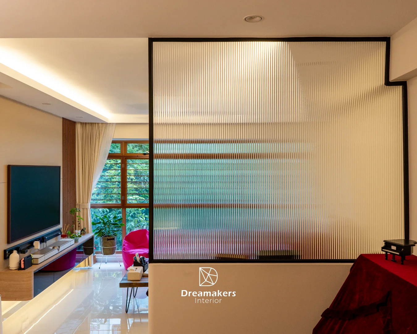 Black-framed fluted glass partition beside the wood slat TV wall, Sengkang 5-room resale HDB living room