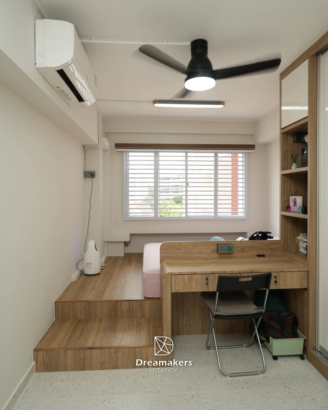 Platform bed with rounded built-in desk and shelving column, Tampines EA resale kids' room