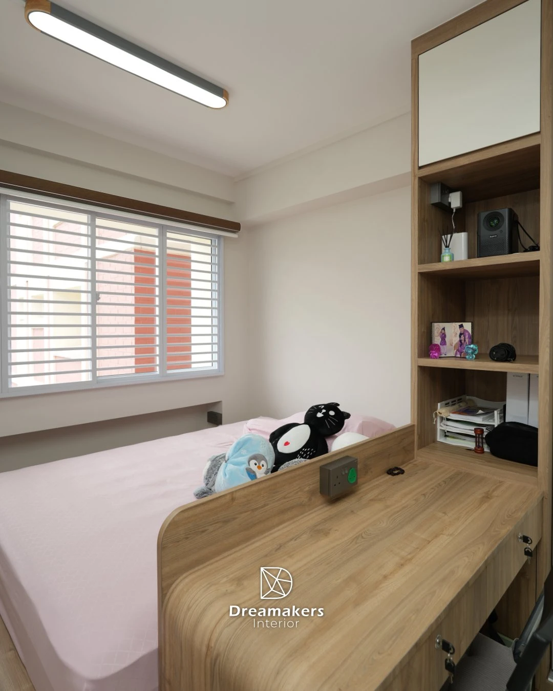 Kids' bedroom with raised platform bed, steps and built-in desk, Tampines executive apartment renovation