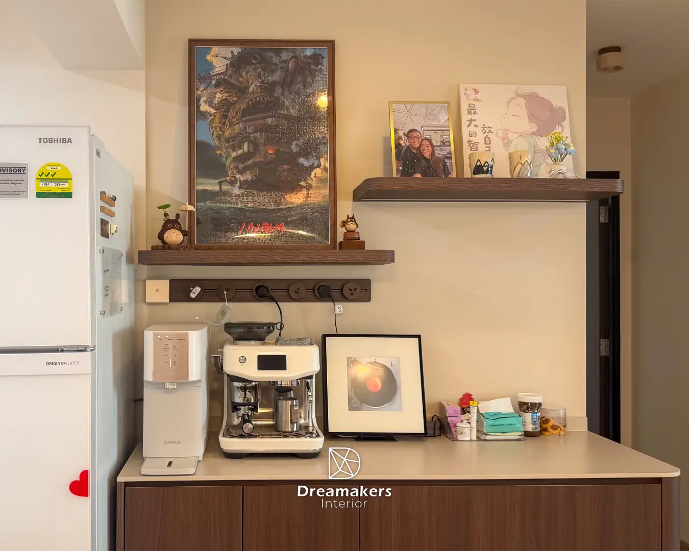 Floating shelves with the couple's framed puzzle and keepsakes above the coffee bar, Sengkang resale flat