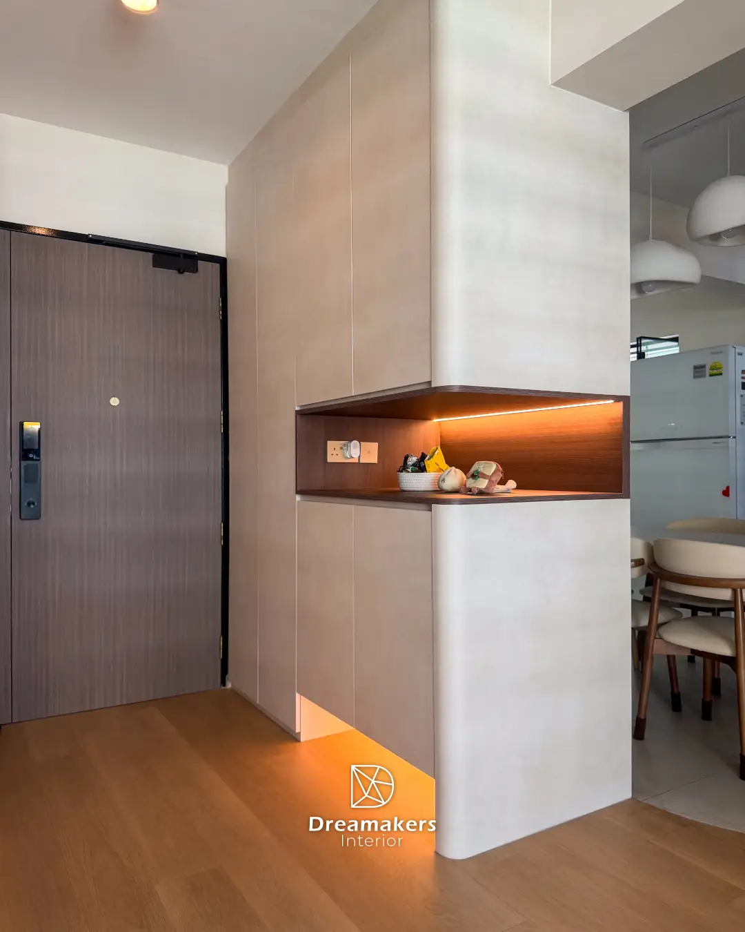 Rounded entryway cabinet with backlit niche seen from the dining area, Sengkang resale renovation