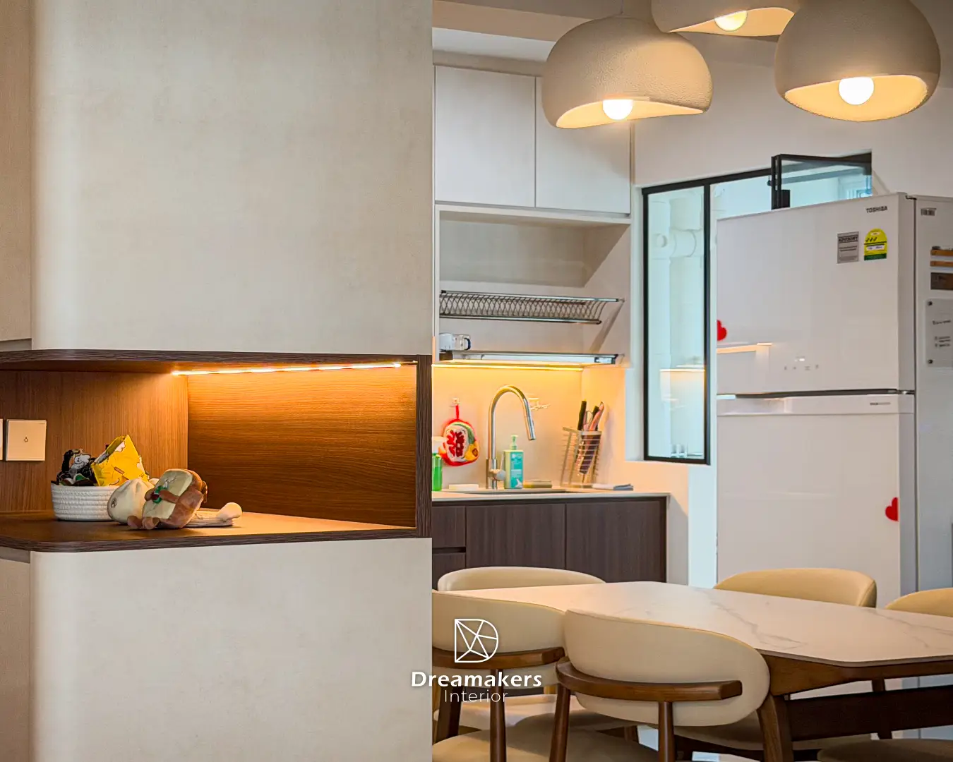 Front door and cream cabinet column with warm lit niche, Anchorvale Crescent 4-room resale HDB entryway