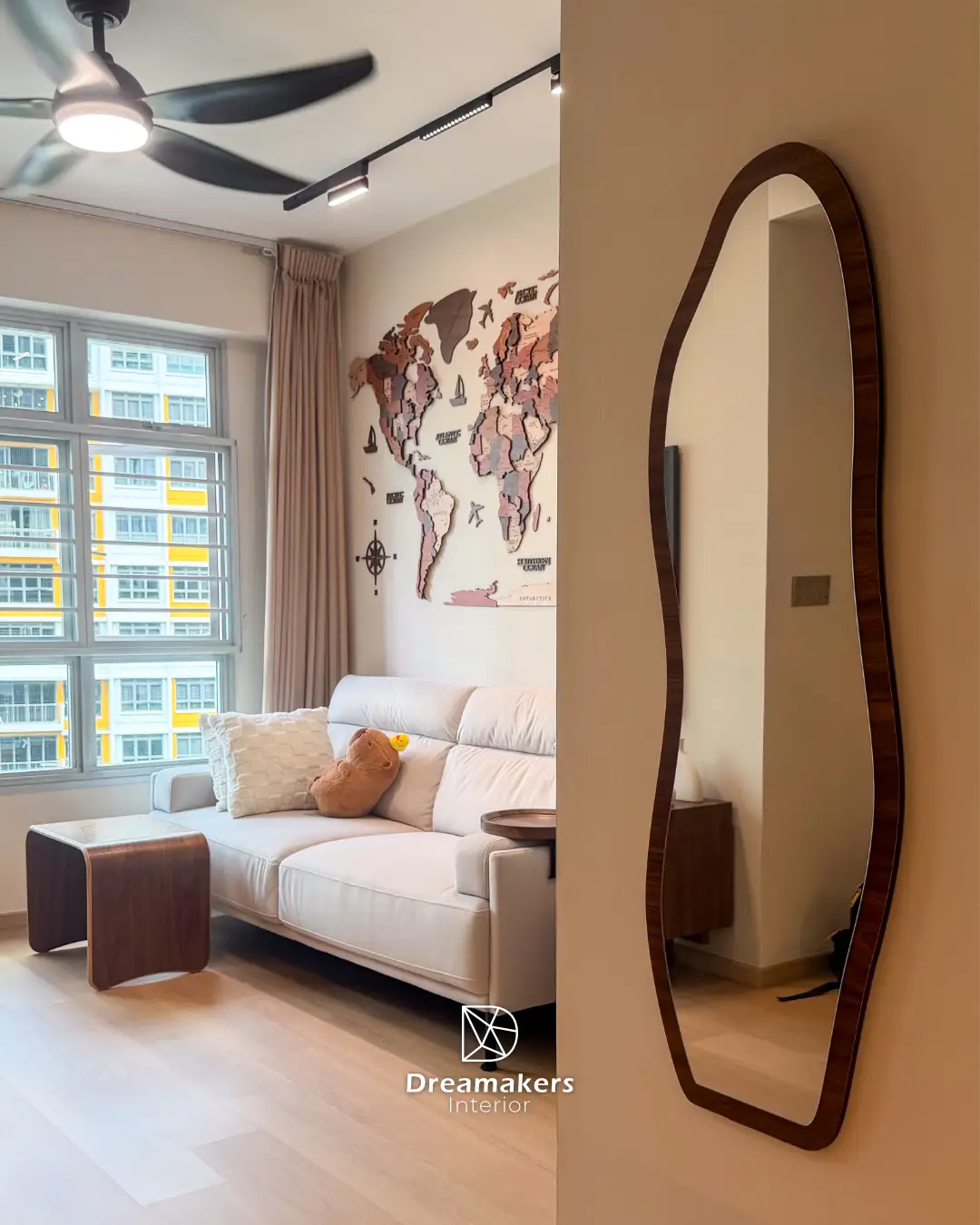 Living room with ceiling fan, track lighting and organic-shaped walnut mirror, Anchorvale Crescent HDB