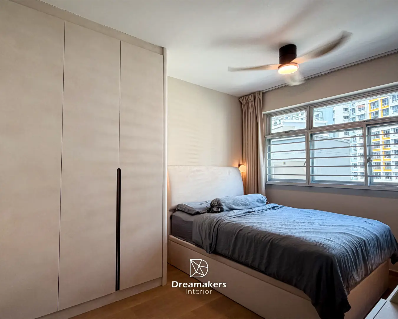 Master bedroom with cream full-height wardrobes and upholstered bed, Sengkang 4-room resale renovation