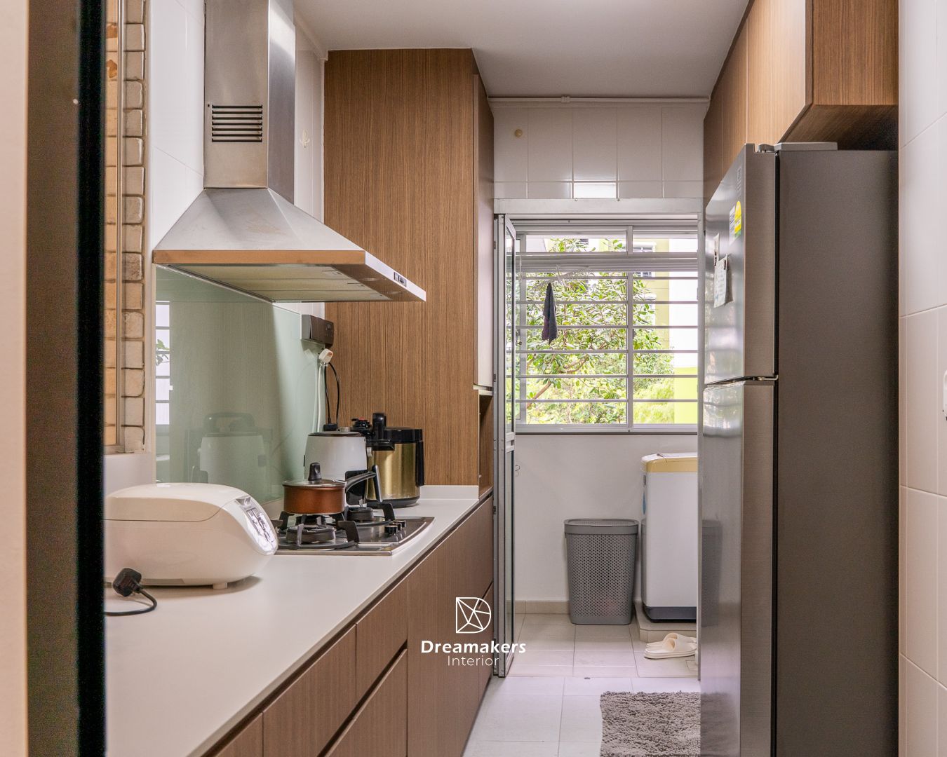 Galley kitchen with wood cabinetry and sage glass backsplash, Chai Chee 4-room resale HDB