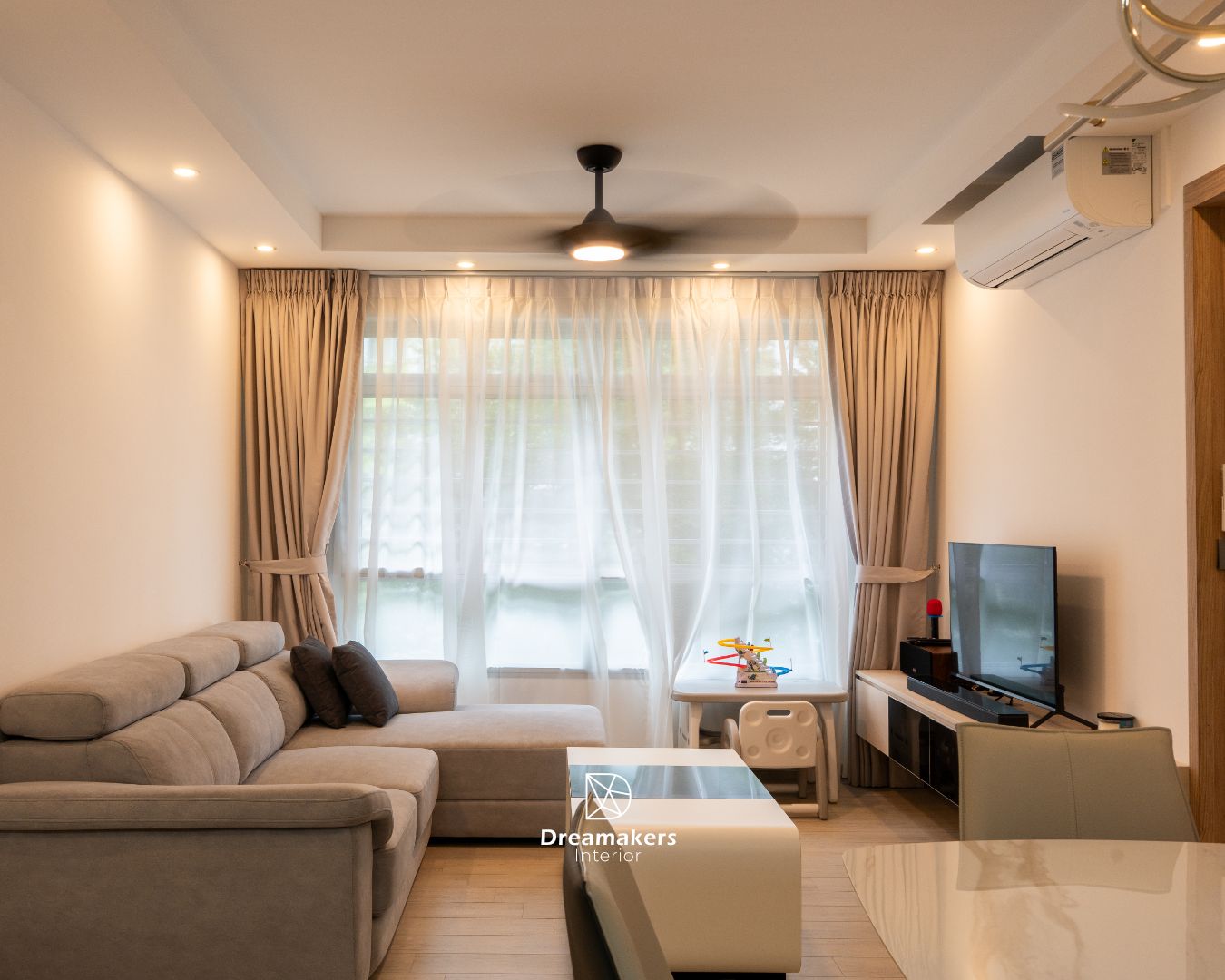 Cosy living room of a 4-room resale renovation at 808C Chai Chee Road with layered curtains and play corner