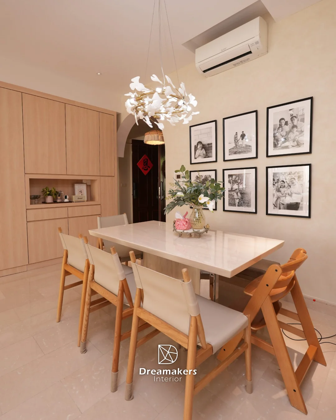 Ginkgo-leaf chandelier over the dining table against limewash-textured walls, Duchess condo renovation