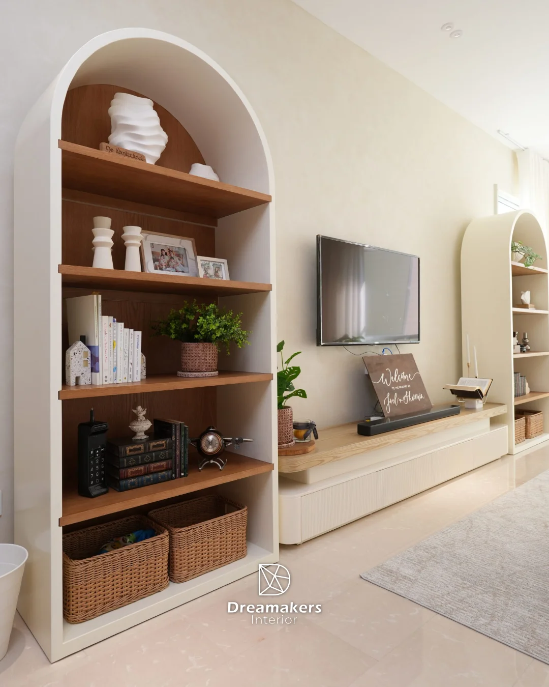 Arched cream display shelf with oak dividers, rattan baskets and keepsakes, Duchess condo renovation