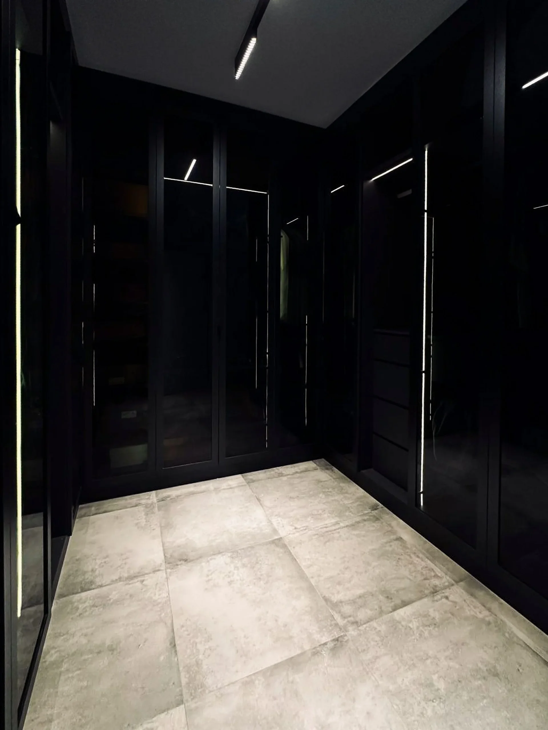Walk-in wardrobe with black tinted-glass doors and integrated LED strips, Hougang resale HDB