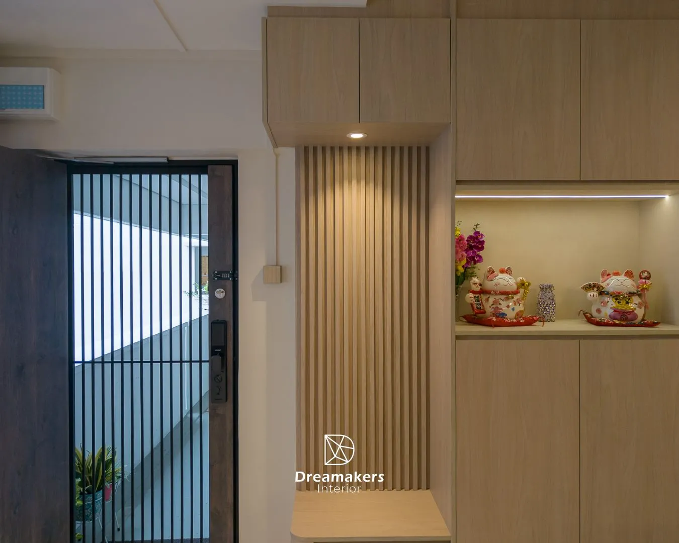 Entryway with wood slat panel, downlight and lit shoe cabinet niches, 746 Jurong West 5-room resale flat