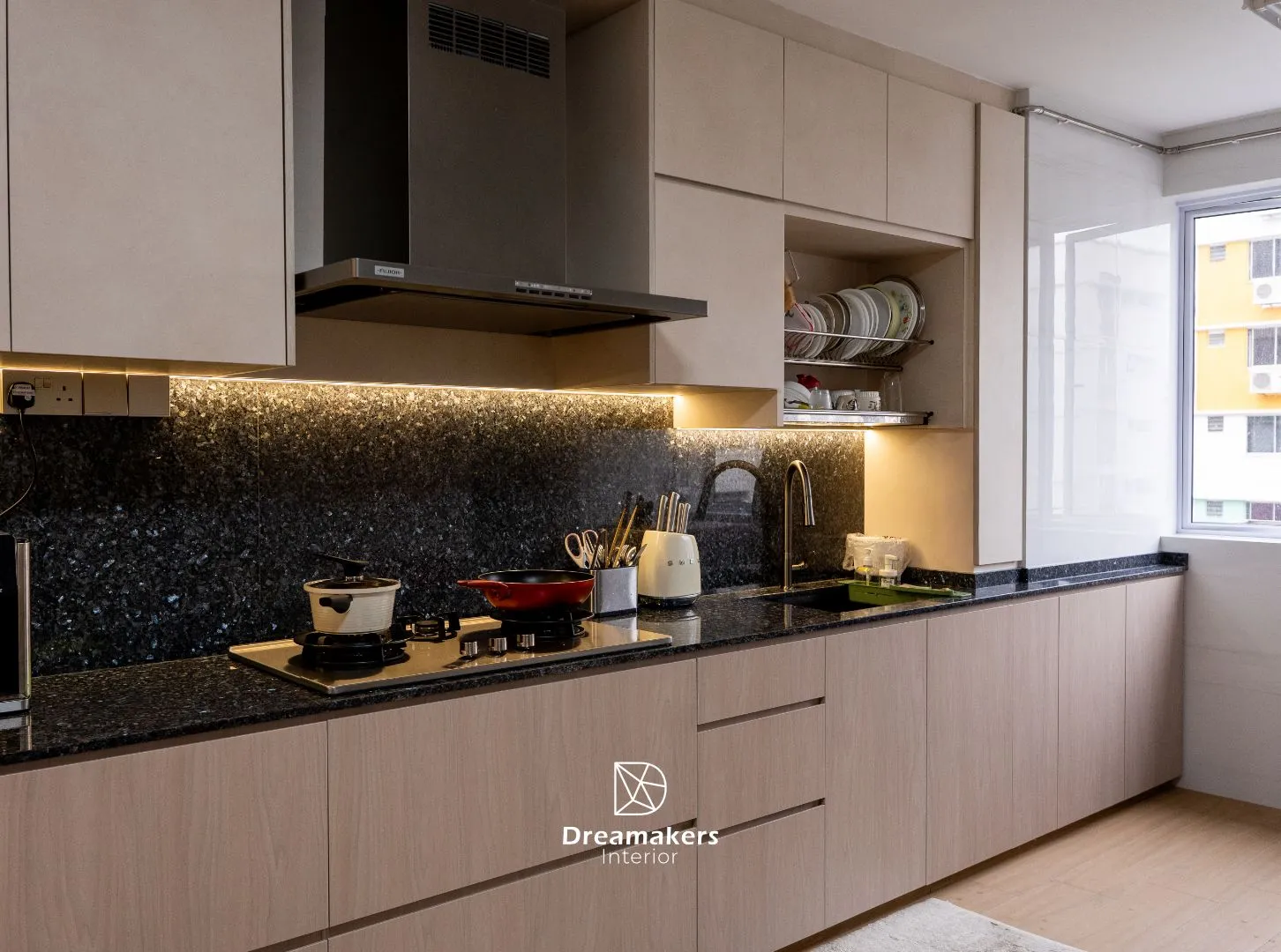 Kitchen with granite worktop and matching granite backsplash under warm cabinet lighting, Jurong West 5-room resale renovation