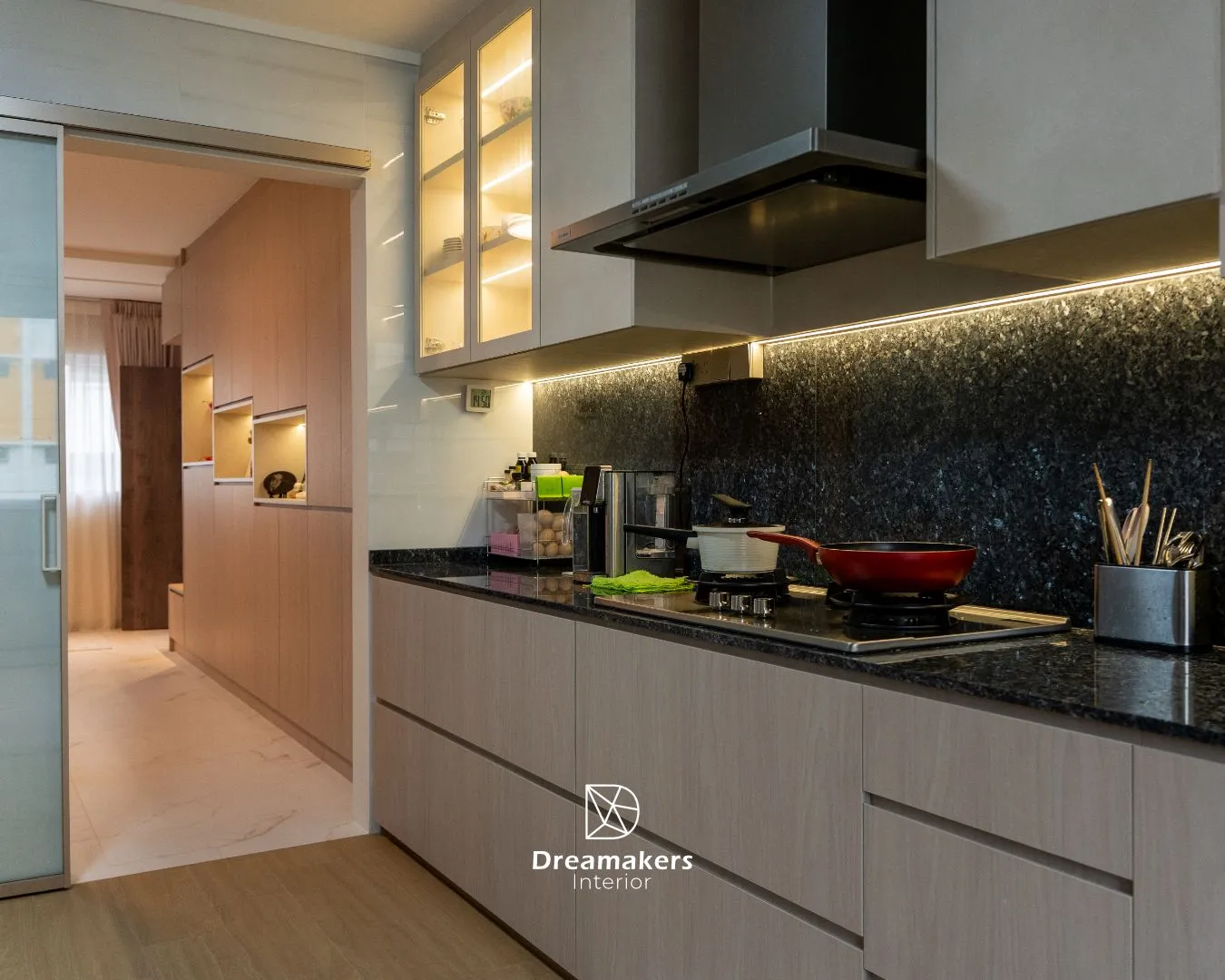 Galley kitchen with granite worktop, lit glass display cabinet and woodgrain cabinetry in a 5-room resale renovation at 746 Jurong West