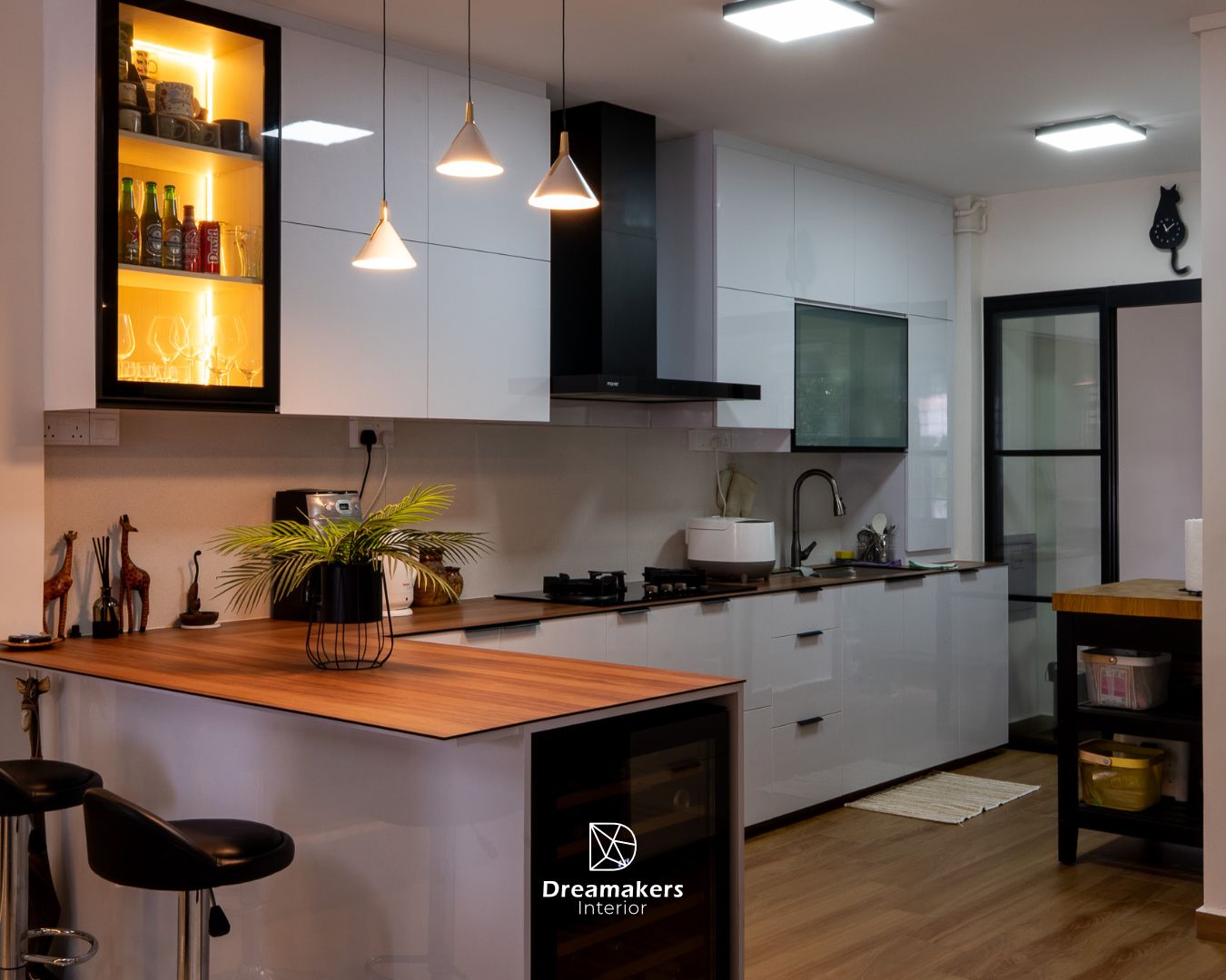 Open kitchen with wood-topped breakfast counter in a 4-room resale renovation at Lengkong Tiga