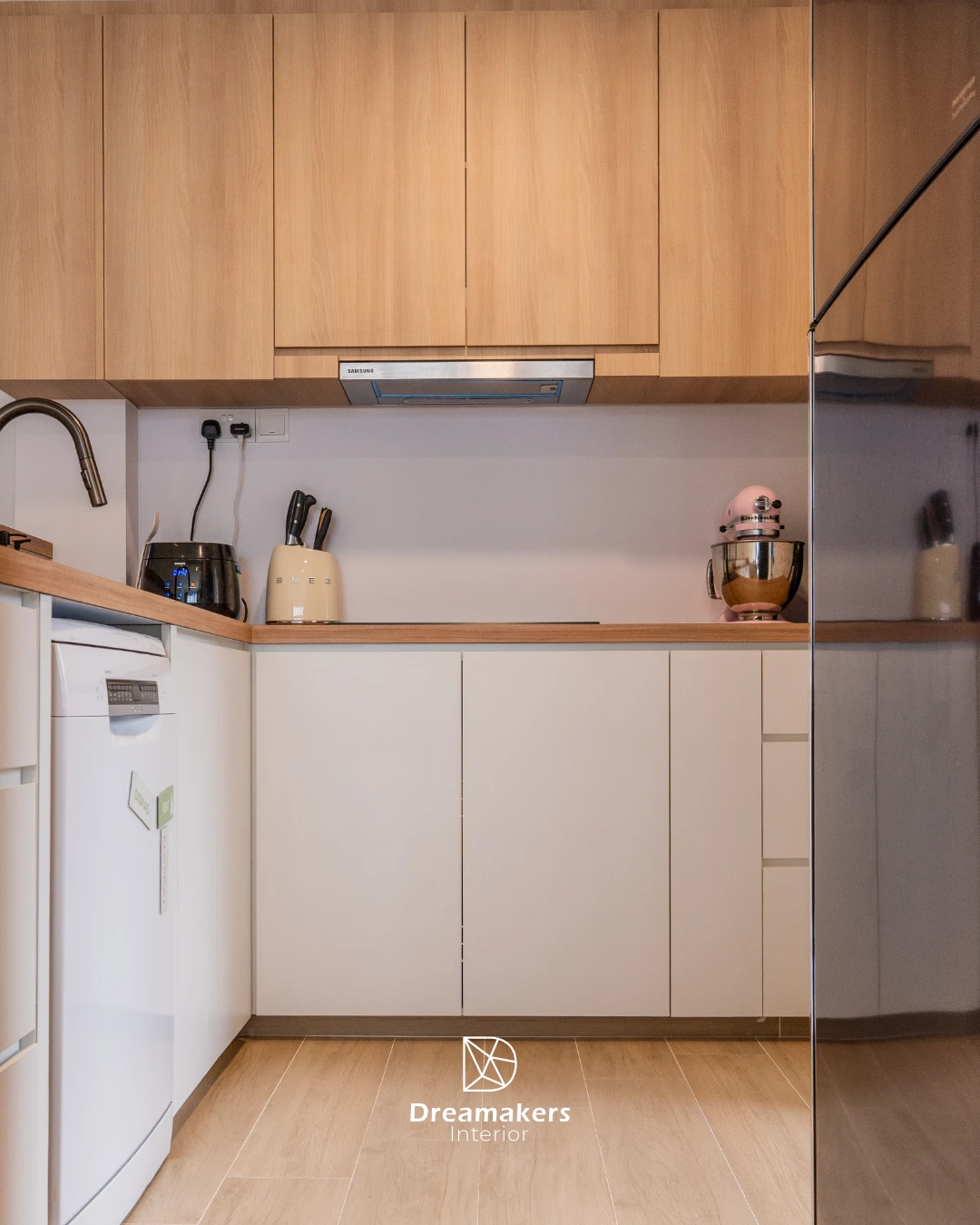 Light oak and cream kitchen with wood-tone worktop and built-in hood, The Eden condo interior design
