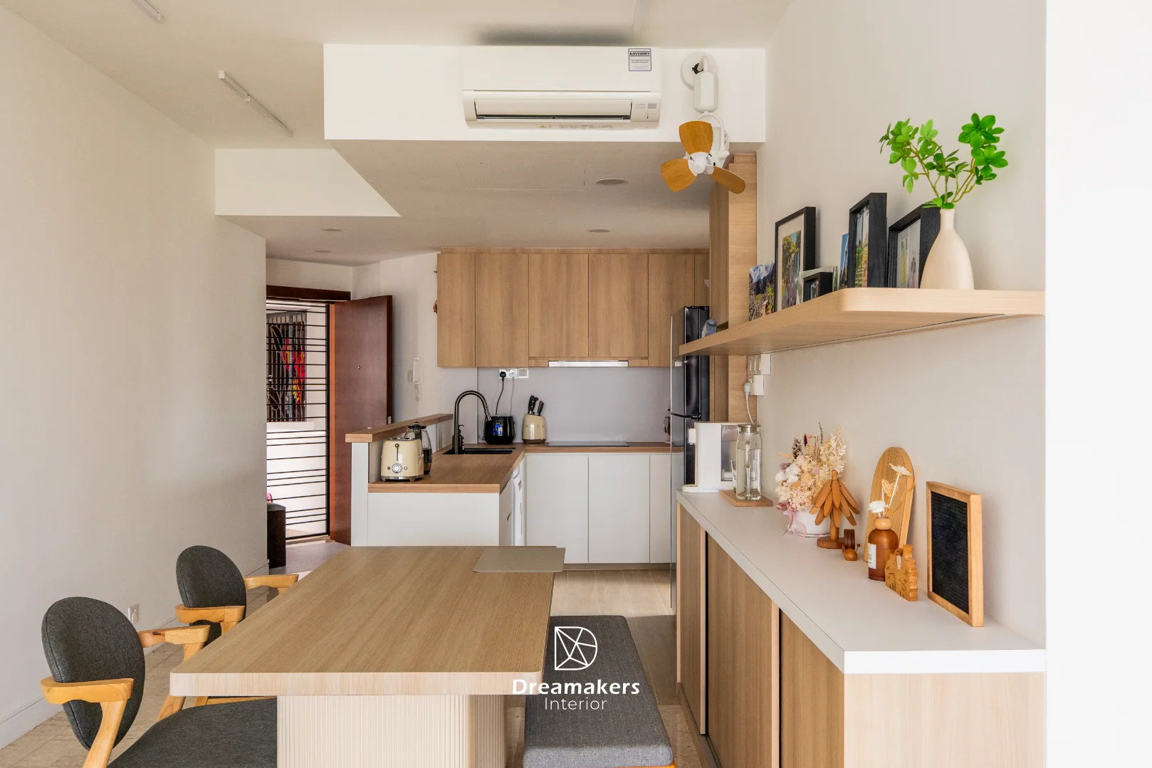 Warm minimalist living room styling with oak accents, The Eden condominium Draycott Park