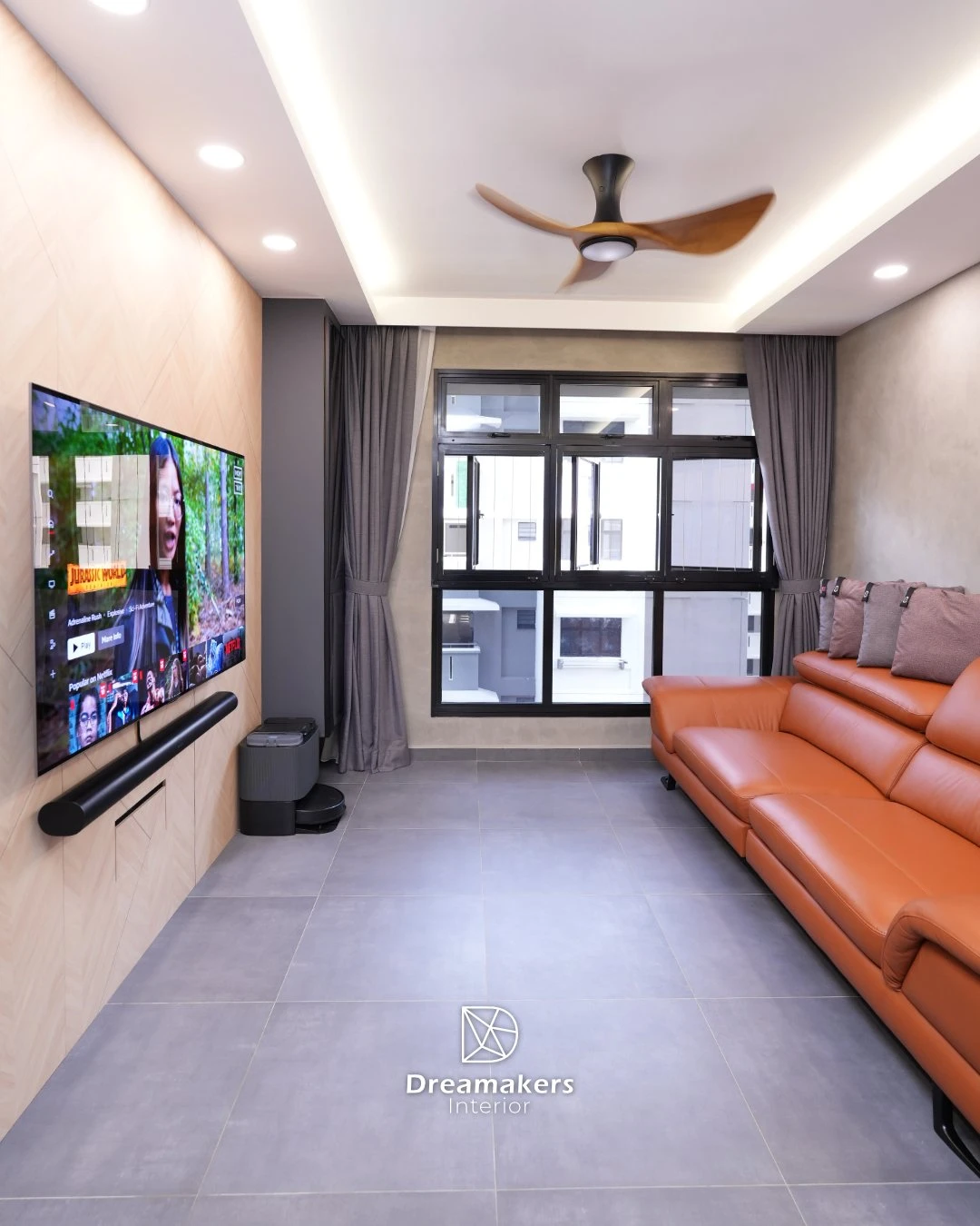 Living room with oak feature TV wall, burnt-orange leather sofa and microcement walls in a 4-room resale renovation at 206D Woodleigh Link, Bidadari